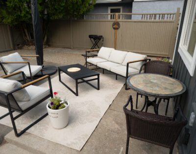 Private outdoor patio with BBQ and dining area overlooking Oliver BC vineyards