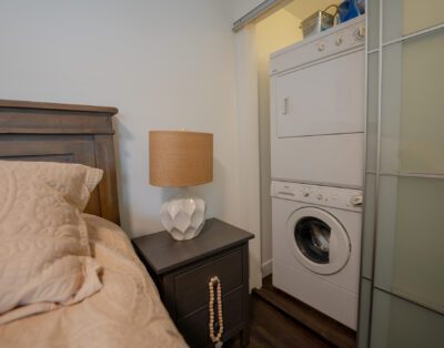 Spacious king-size bedroom with luxury linens and ample storage at Rockcliffe Getaway couples retreat with washer and dryer
