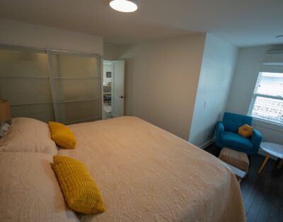 Spacious king-size bedroom with luxury linens and ample storage at Rockcliffe Getaway couples retreat