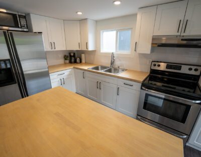 Fully equipped kitchen with full stove and modern appliances at Rockcliffe Getaway vacation rental