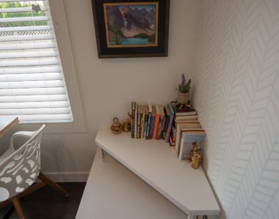 Cozy living room with curated book collection and soundproofed walls at Rockcliffe Getaway Oliver BC