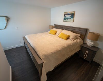 Spacious king-size bedroom with luxury linens and ample storage at Rockcliffe Getaway couples retreat