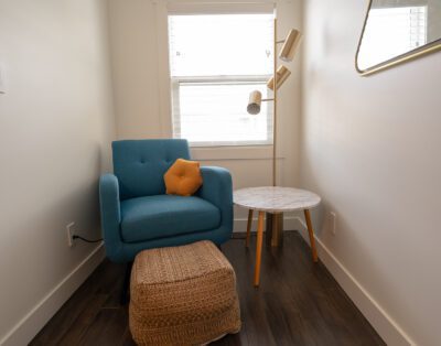 Spacious sitting and reading area in king-size bedroom with luxury linens and ample storage at Rockcliffe Getaway couples retreat